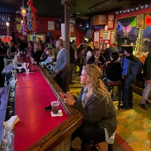 a crowd of people at a bar