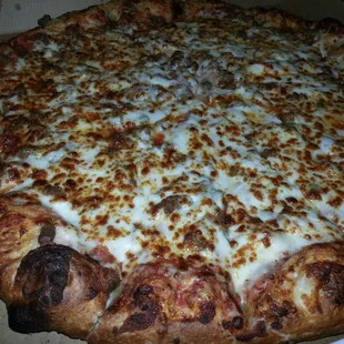 Beef, pepperoni, extra cheese.  They put their toppings underneath the cheese.