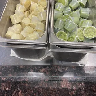 two trays of food on a counter