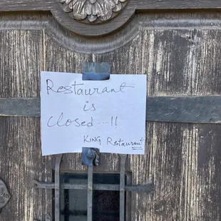 a restaurant closed sign on a door