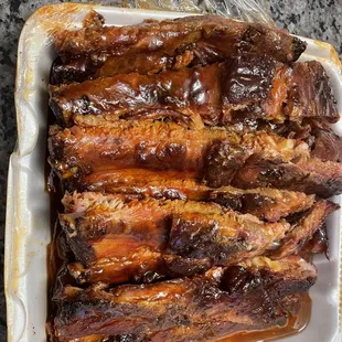 a close up of a tray of ribs