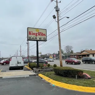 a parking lot with tables and benches