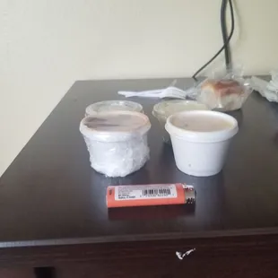 I put my lighter in the picture so you can see the portion size is extremely small. About 3 bites of food. Smh