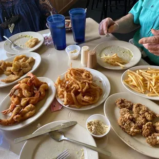 Fried orange roughy, fried oysters and gigantic shrimp, onion rings, French fries. Best ever tartar sauce.