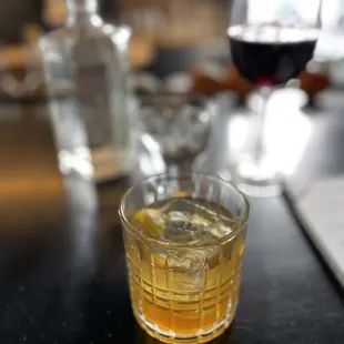 a glass of whiskey on a table