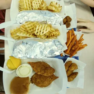 a tray of fried chicken and waffle fries
