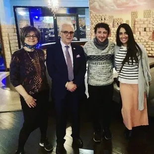 My husband and I with the owners of the restaurant.