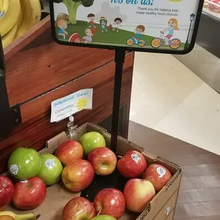 a display of apples and bananas