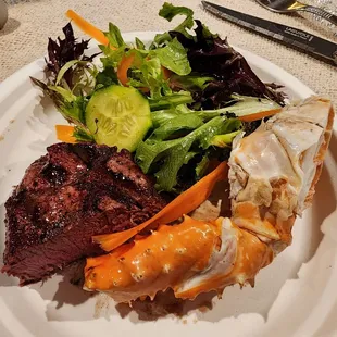 Salad mix, king crab legs and filet mignon.