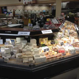 a display of cheeses in a store