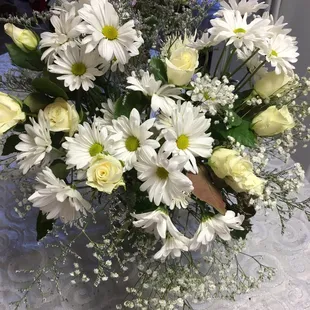 a bouquet of white and yellow flowers