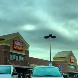 cars parked in front of a store
