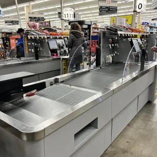 Self check out with a conveyor belt