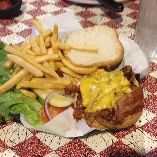 Burger with cheese, bacon, and grilled onions