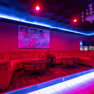 red couches and a chandelier