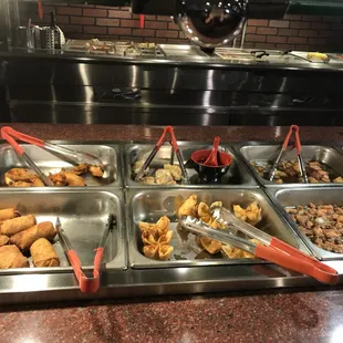 a variety of food items in a buffet