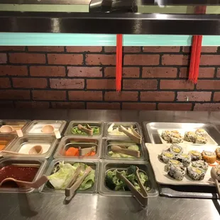 a variety of food items in a buffet