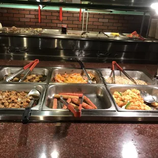 a variety of food items in a buffet