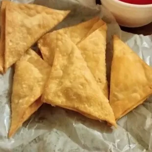 Crab Rangoon and sweet and sour sauce