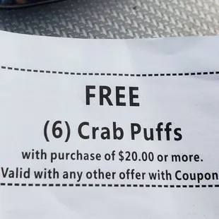 a coup of crab puffs with purchase of $ 20 00 or more not valid with any other offer with coup