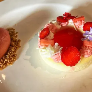 Strawberry Rhubarb Cheesecake whipped strawberry white chocolate, rhubarb confit, graham streusel, strawberry sorbet, edible flowers