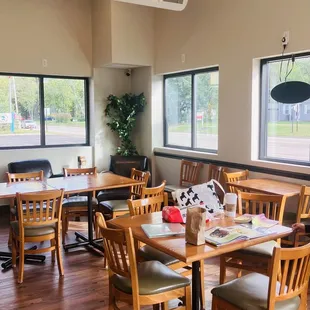 a dining area with tables and chairs