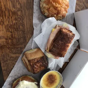 Top: savory scone, breakfast croissant, chocolate croissant, crème brûlée, cinnamon roll