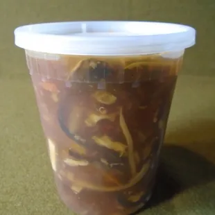 A BIG hot sour soup in my to-go container.