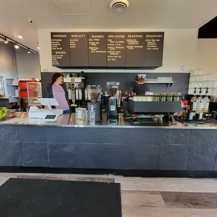 a woman working behind the counter