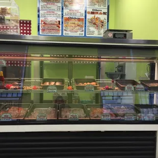 a display case with a variety of food items