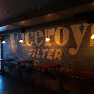 a brick wall with a sign that says victory's bitter