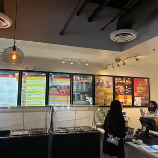a woman ordering food at a restaurant