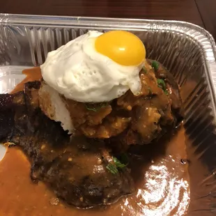 Our Smoked Stuffed Turkey Legs with White Rice and Homemade Gravy with a egg on top.our Version of what we call (The Loco Moco)