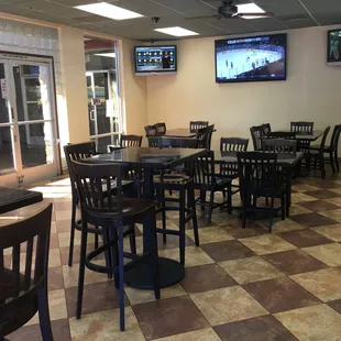 Dining room seating with the game on.  Ice-cold beers on tap.