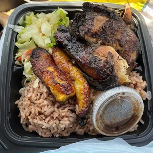Jerk Chicken Plate with rice and peas, plantain and veggies.  Yummy