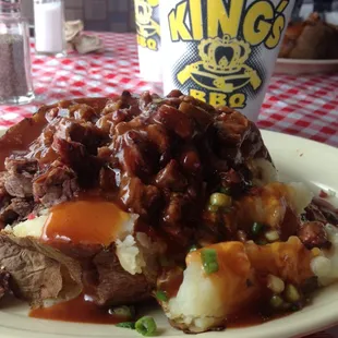 Baked potato with smothered BBQ Brisket and a Sweet Tea