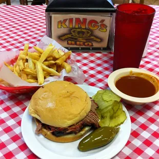 Sliced brisket sandwich and fries