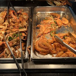 two trays of cooked crabs