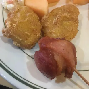 Chicken nuggets and a Fried Bacon wrapped Hot Dog.