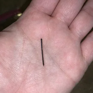 a person&apos;s hand holding a knife