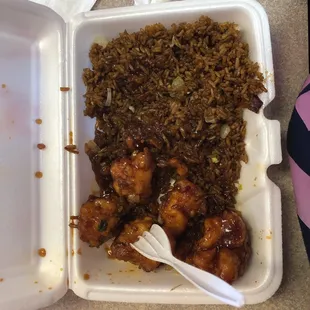 chicken and rice in a styrofoam container