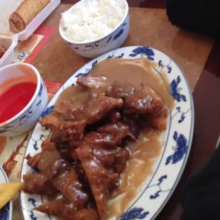 a plate of meat and rice