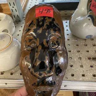 A clay mask clearly made by a school kid, $4.95., lol