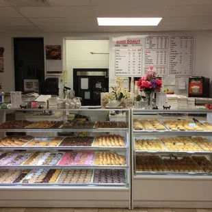 a display case with a variety of donuts