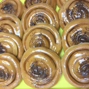 a tray of glazed donuts