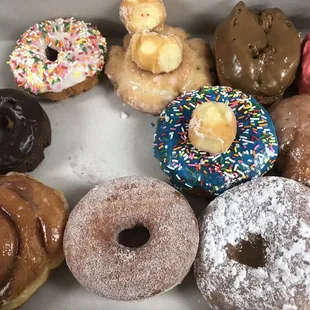 One dozen donuts for $16 with a couple donut holes for fun. My coworker ate one before I could take this picture, hence the space void.