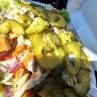 a salad in a styrofoam container