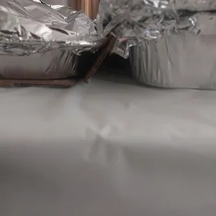 The shorter tray is the tray of salt and pepper wing