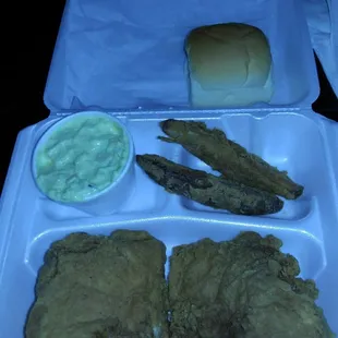 Two spicy breasts,wedges,and potatoe salad.
