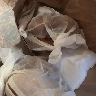a sandwich wrapped in plastic
